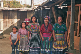 Matron Patrona Pichiyà, Patzicía, has taught both her daughters, Pilar and Santa, to weave on a backstrap loom.  They, however, often choose to weave and wear styles of other communities. Photo by Cheryl Guerrero 2005.