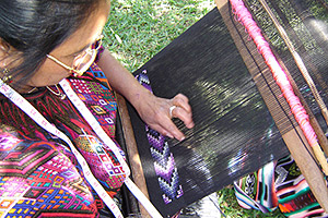 María Tol Perez, who lives in Quejel, Chichicastenango, weaves a textile that will be used to make  Maya Traditions artisan products for export.  María travels to Panajachel occasionally for training in the group's compound in Panajachel.  Photo by Denise Gallinetti 2005.