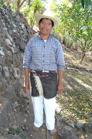 Vicente 'Chema' Queche, 80, works as a gardener on a steep slope in Panajachel.  He wears the rodillera still worn by some older Maya men in the Sololá department.  It is woven on a back strap loom of handspun wool.  Photo by Denise Gallinetti 2005.