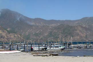 The waters of Lake Atitlán can be rough by the docks of San Pedro La Laguna where travelers catches a launch to Santiago Atitlán, Panajachel or one of the other lakeside communities.  Photo by Denise Gallinetti 2005.