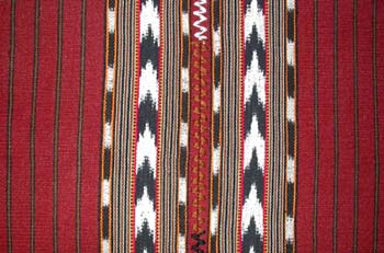 Jaspe or ikat weaving on back strap looms can be found in San Pedro La Laguna.  This tablecloth is made of two panels joined by a zigzag stitch. Photo by Kathleen Mossman Vitale 2005.