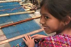 Jesica Maricruz Panjoj Lopez, 8, is already an accomplished back strap loom weaver in the style of San Lucas Tolimán.  Weavers often stick to the style of their place of birth, even if economics or marriage forces relocation.  Photo by Kathleen Mossman Vitale 2004.