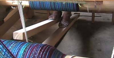 Some Maya women now use floor looms, either because young men in the family must travel far from home in search of work, or because of their own ingenuity.  The owner of this new floor loom is Sandra Lopez Perez.  Photo by Kathleen Mossman Vitale 2004.