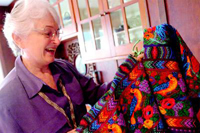 Valleo Videographer Kathleen Mossman Vitale displays a huipil woven by Esperanza Lopez.