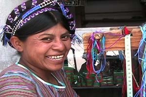 Manuela Martin Perez wears a cinta or ribbon to tie up her long hair.  She lives in San Antonio Palopó, has a small tourist shop, and weaves to help support her family.  Photo by Kathleen Mossman Vitale 2004.